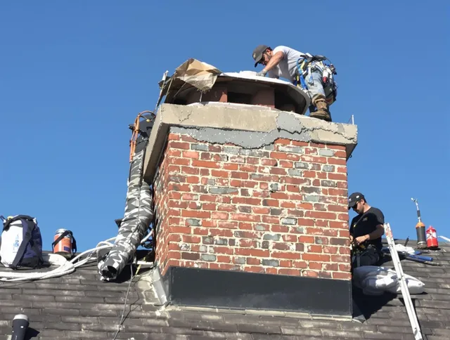 Poinciana Chimney Sweep installing a custom chimney crown in Poinciana, FL